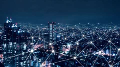 Digital network above city at night